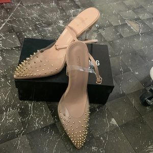 Shoes with spikes on them.